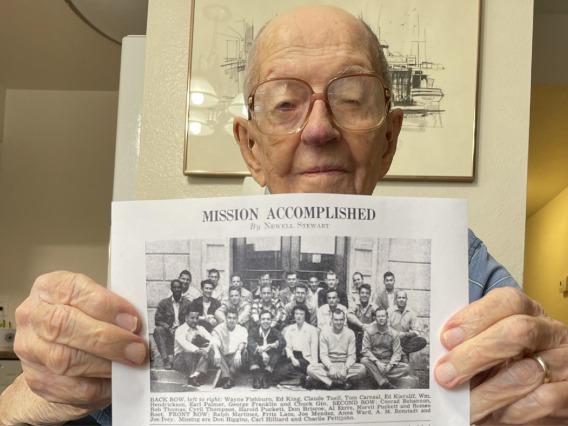 Gene Thompson holds up his Class of 1950 photo. 