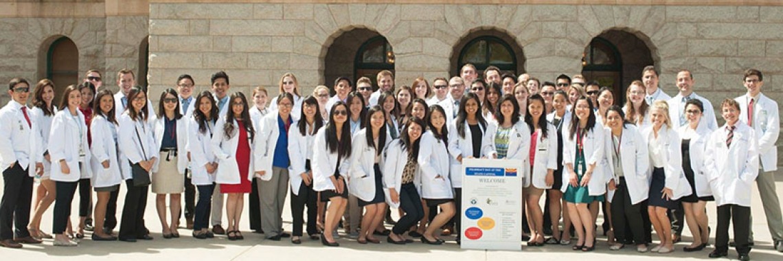 a big group of American Pharmacists in white coats