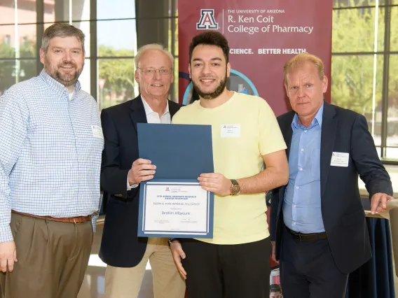 Students and faculty posing during an Awards Event. 