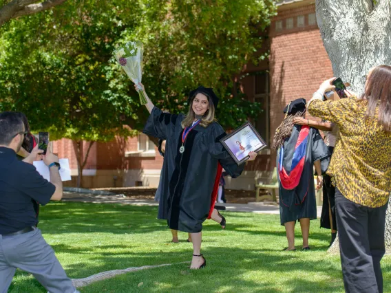 Student posing for graduation photos
