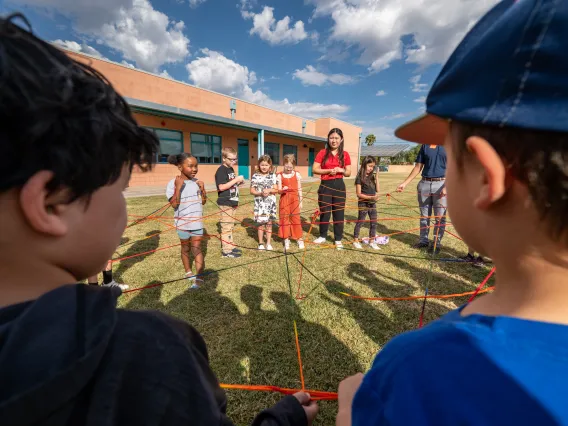 Elementary School Students participate in the How Diseases Spread activity