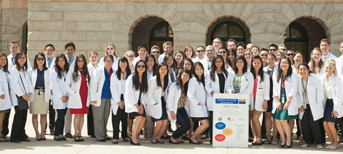 a big group of American Pharmacists in white coats
