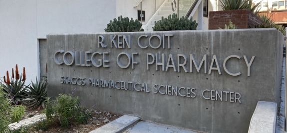 Building sign that says R. Ken Coit College of Pharmacy Skaggs Pharmaceutical Sciences Center