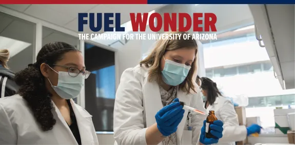 Fuel Wonder Graphic | Two women pipetting liquids into a medicine bottle.
