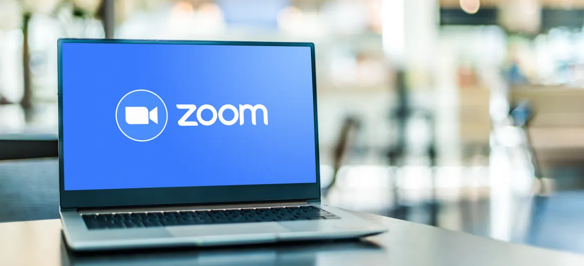 Laptop with the Zoom logo on the screen.
