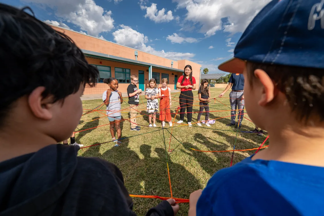 Elementary School Students participate in the How Diseases Spread activity