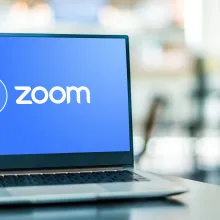 Laptop with the Zoom logo on the screen. 