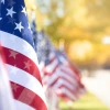 American flags line a sidewalk